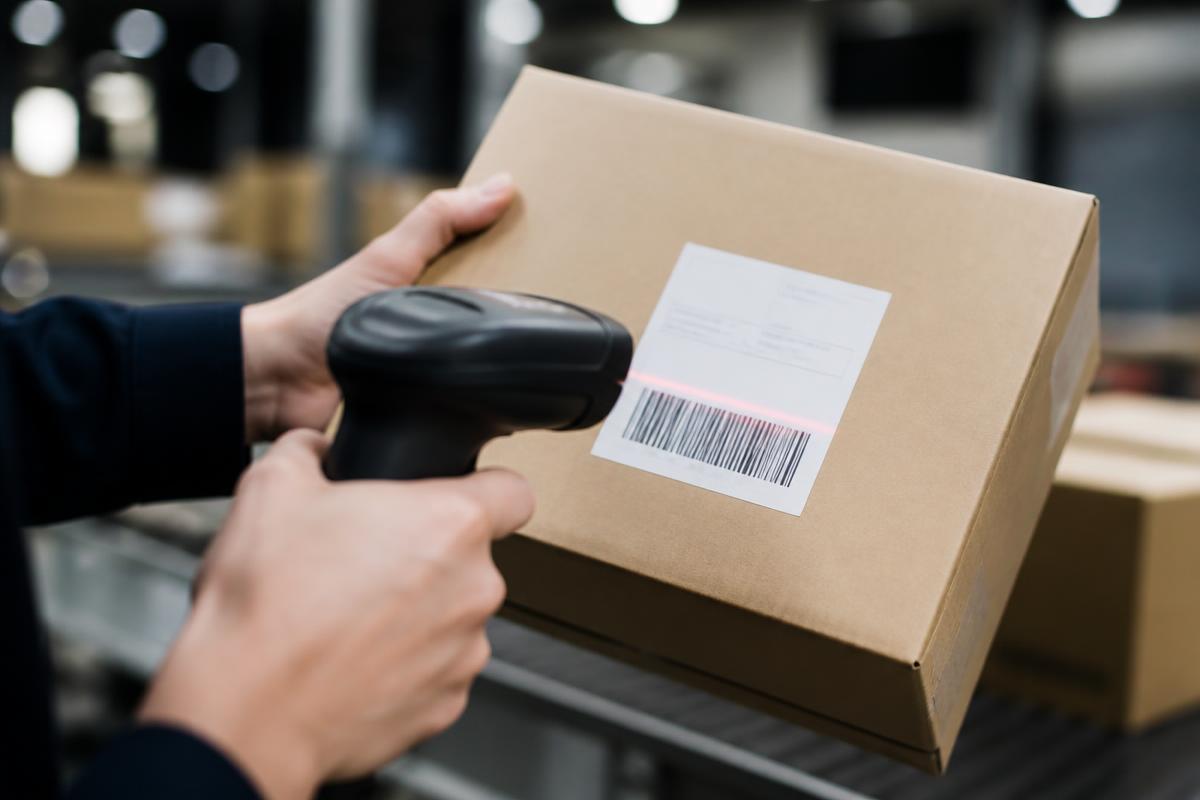 Warehouse operator scanning a parcel barcode